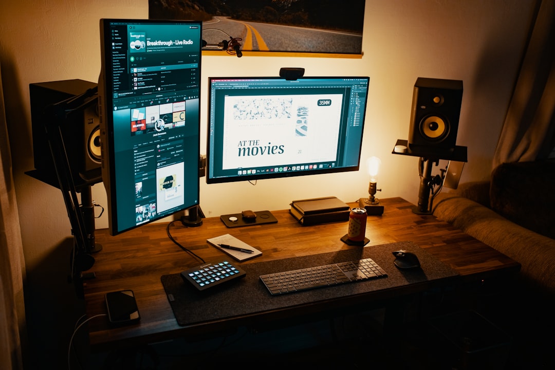 black-flat-screen-computer-monitor-turned-on-beside-black-remote-control-gaval6zcplu